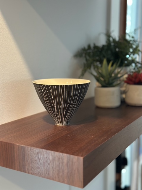 Warm interior detail with wood and ceramic